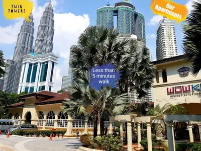 a sign in front of a building with tall buildings at Parkview KLCC Serviced Suites in Kuala Lumpur