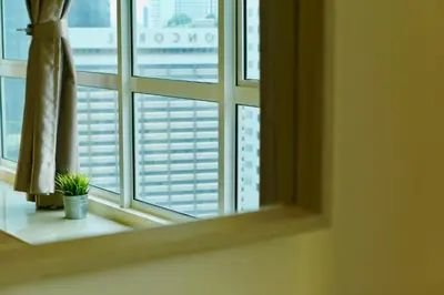 a window with a view of a city at Parkview KLCC Serviced Suites in Kuala Lumpur