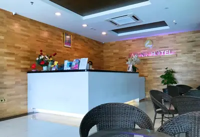 a bar in a restaurant with chairs and a counter at Lavana Hotel, Chinatown in Kuala Lumpur