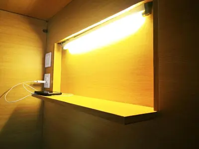 a bathroom with a window with a light on it at Chinatown Hostel by Mingle - Rooftop Private Jacuzzi with Bar in Kuala Lumpur
