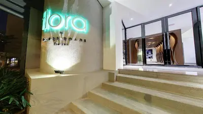 a building with stairs in front of a window at Flora by Crossroads Hotel in Kuala Lumpur