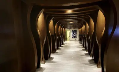 a row of wine barrels in a wine cellar at Flora by Crossroads Hotel in Kuala Lumpur