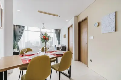 a dining room with a table and chairs at Vortex KLCC Apartments in Kuala Lumpur