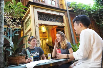 a group of people sitting at a table in front at Classic Malay House in KL City Centre in Kuala Lumpur