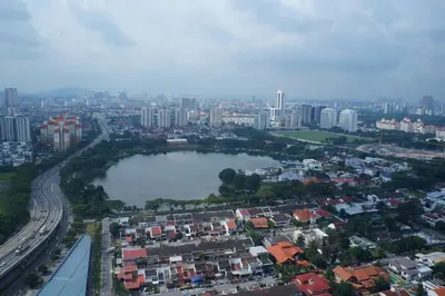 an aerial view of a city with a river and buildings at M City Lake View KLCCAmpang in Kuala Lumpur