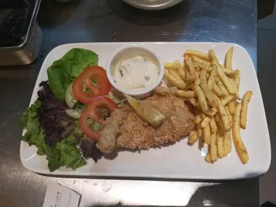 a white plate of food with french fries and a sandwich at InnB Park Hotel in Kuala Lumpur