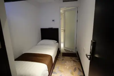 a small bedroom with a small bed in a room at InnB Park Hotel in Kuala Lumpur