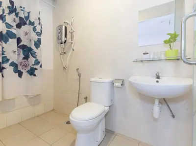 a bathroom with a toilet and a sink at Fumah Hotel Jalan Kuching in Kuala Lumpur