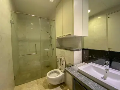 a bathroom with a shower and a toilet and a sink at The Platinum Kuala Lumpur by LUMA in Kuala Lumpur