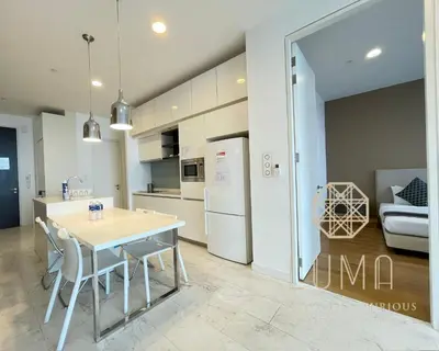 a kitchen and dining room with a table and chairs at The Platinum Kuala Lumpur by LUMA in Kuala Lumpur