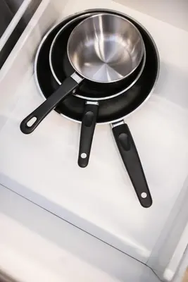 a frying pan on top of a stove at KL Sentral Bangsar Suites (EST) by Luxury Suites Asia in Kuala Lumpur