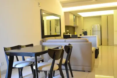 a dining room with a table and chairs at Apartment by WGS Homestay Bukit Bintang in Kuala Lumpur
