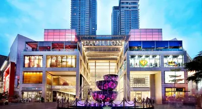 a large building with a purple vase in front of it at Apartment by WGS Homestay Bukit Bintang in Kuala Lumpur