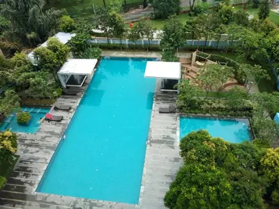 an overhead view of a pool with blue water at Apartment by WGS Homestay Bukit Bintang in Kuala Lumpur