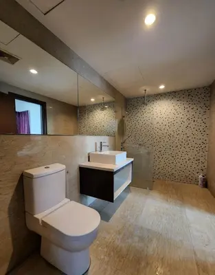 a bathroom with a toilet and a sink at Suites & Residences @ Regalia by PLC in Kuala Lumpur