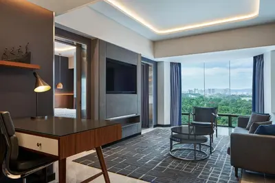 a hotel room with a view of a living room at Le Méridien Kuala Lumpur in Kuala Lumpur
