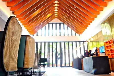 a lobby with a large window and orange ceiling at MOV Hotel Kuala Lumpur in Kuala Lumpur