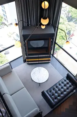 a living room with a couch and a table at MOV Hotel Kuala Lumpur in Kuala Lumpur