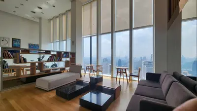 a living room with a couch and a table at KL Platinum KLCC By Hive KL in Kuala Lumpur