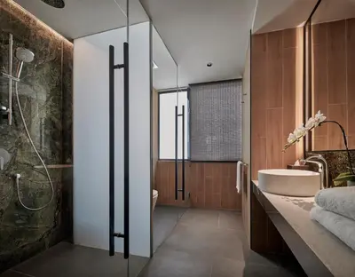 a bathroom with a tub and a sink and a shower at PARKROYAL COLLECTION Kuala Lumpur in Kuala Lumpur
