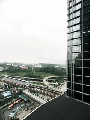 an aerial view of a city with a tall building at KL Gateway Residency in Kuala Lumpur