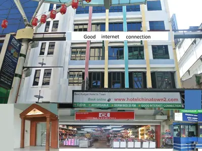a building with signs on the front of it at Hotel China Town 2 in Kuala Lumpur