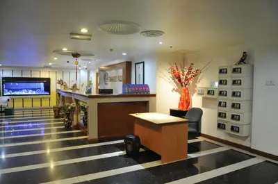 a lobby with a bar and a tv in a building at Hotel China Town 2 in Kuala Lumpur