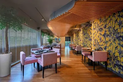 a dining room with tables and chairs in a restaurant at Concorde Hotel Kuala Lumpur in Kuala Lumpur