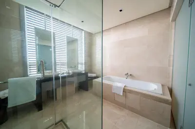 a bathroom with a bath tub and a sink at St Giles Boulevard in Kuala Lumpur