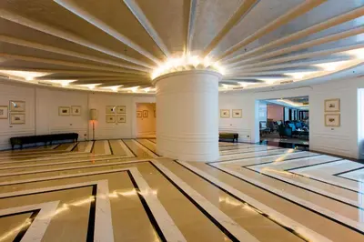a large room with columns and a ceiling at The Ritz-Carlton, Kuala Lumpur in Kuala Lumpur