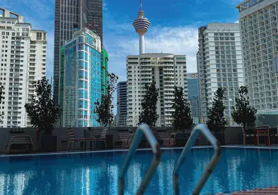 a view of a large swimming pool in a city at Starus Hotel Bukit Bintang in Kuala Lumpur