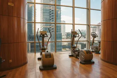 a gym with cardio machines in a room with a large window at St Giles Mid Valley Kuala Lumpur in Kuala Lumpur