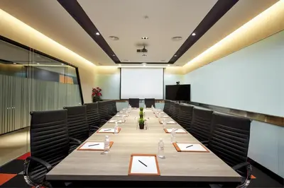 a large conference room with a long table and chairs at Sunway Velocity Hotel Kuala Lumpur in Kuala Lumpur