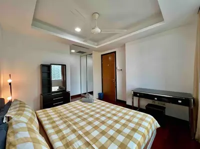 a bedroom with a bed and a piano at Casa Residency Apartment in Kuala Lumpur
