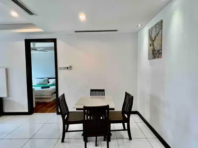 a dining room with a table and chairs at Casa Residency Apartment in Kuala Lumpur