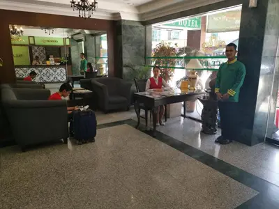 a group of people sitting at a table in a restaurant at Palace Hotel in Kuala Lumpur