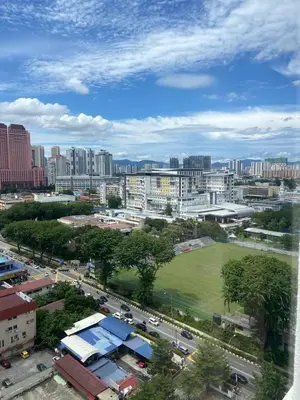 an aerial view of a city with buildings and a park at Arina Unity in Kuala Lumpur
