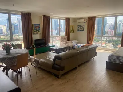 a living room with a couch and a table at Arina Unity in Kuala Lumpur
