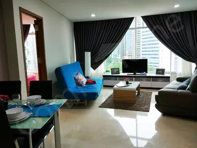 a living room with a blue chair and a couch at 5 STAR & LUXURY Apartment near KLCC/ KL City Centre in Kuala Lumpur