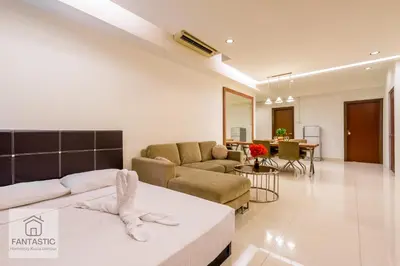 a living room with a couch and a table at Regalia Residence @ KLCC View Sky Pool by MC in Kuala Lumpur