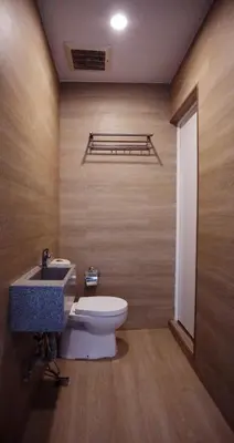 a bathroom with a toilet and a sink at Vivids Hotel in Kuala Lumpur