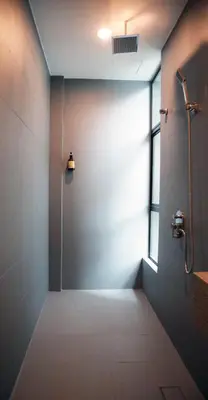 a bathroom with a shower stall and a window at Vivids Hotel in Kuala Lumpur