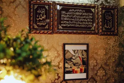 a framed picture on a wall with a picture on it at Frenz Hotel Kuala Lumpur in Kuala Lumpur