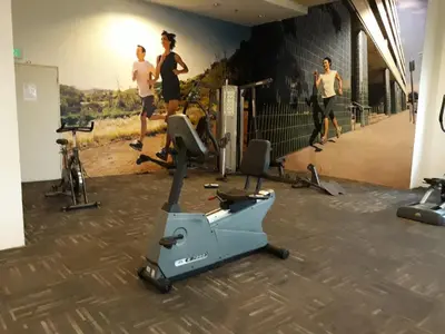 a group of men running in a gym at Taragon Putrie Bintang suites in Kuala Lumpur