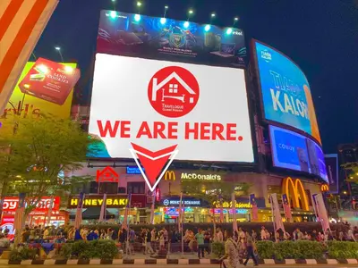 a large sign that says we are here in a city at Travelogue Guest House in Kuala Lumpur