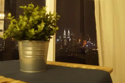 a potted plant sitting on a table in front of a window at Sentrio Pandan Kuala Lumpur in Kuala Lumpur