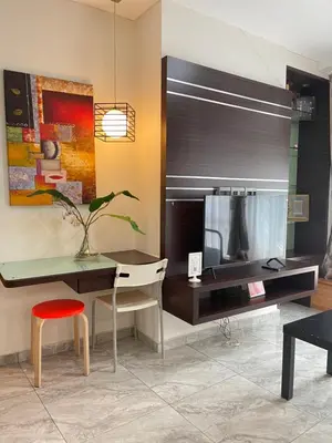 a desk with a chair and a table with a mirror at Parkview Suite KLCC, Myhomey in Kuala Lumpur