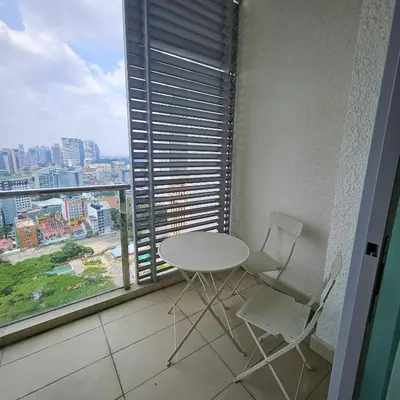 a table and two chairs in a room with a window at Royal Suite in Kuala Lumpur