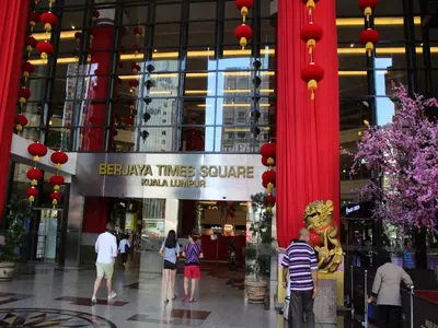 a group of people walking in a shopping mall at FnF Suite @ Time Square in Kuala Lumpur
