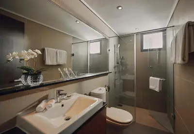 a bathroom with a sink and a shower and a toilet at TRILLION SUITES by SLG in Kuala Lumpur
